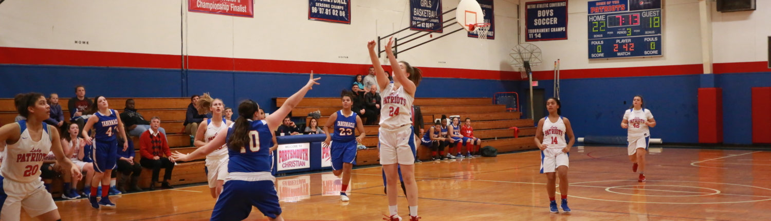 Girl taking basketball shot